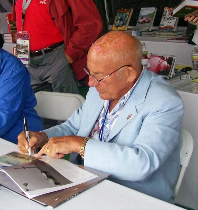 Name:  Stirling Moss signing books. August 2011.jpg
Views: 798
Size:  83.7 KB