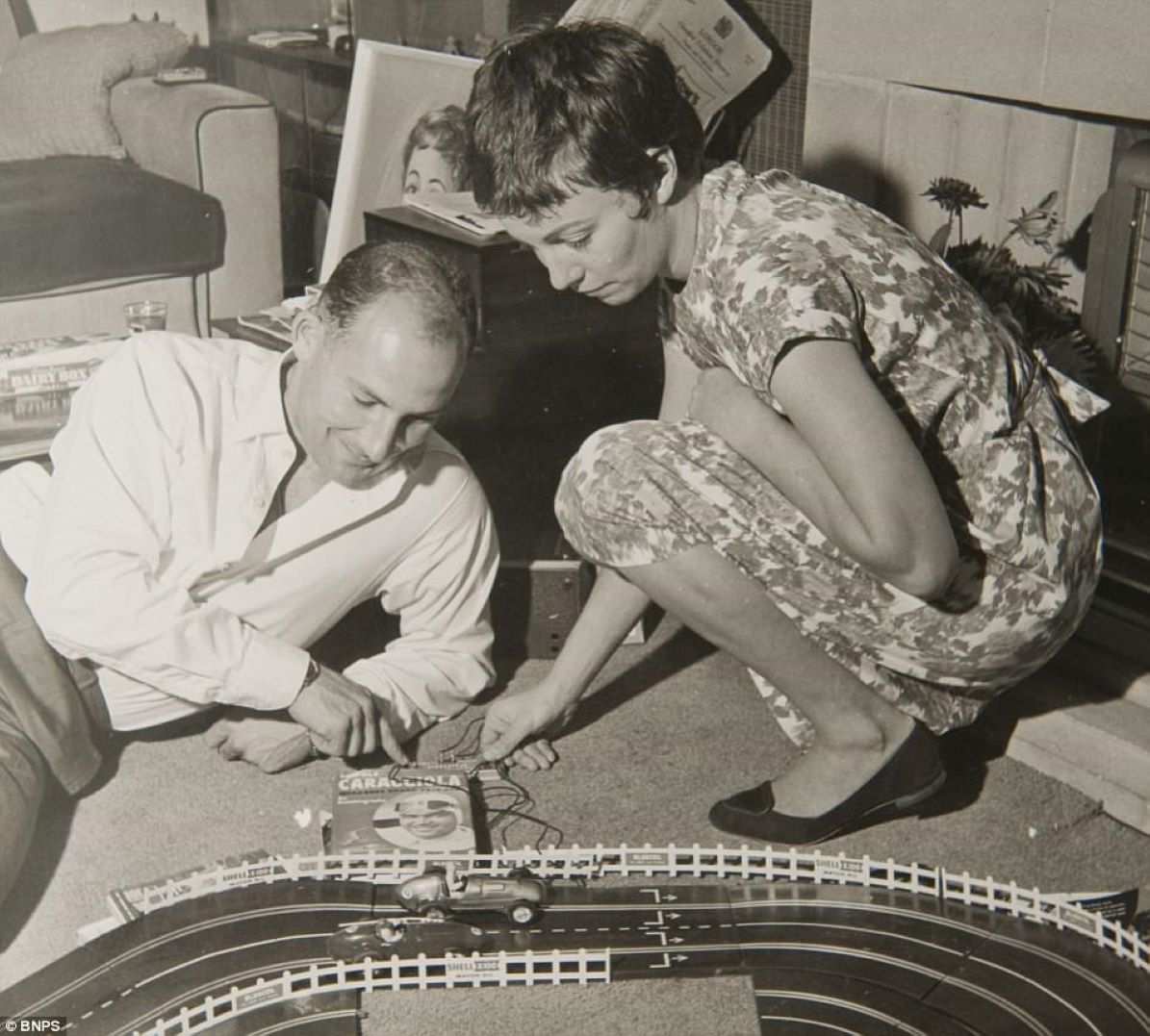 Name:  Model scene #159 Stirling Moss plays Scalextric set with wife Katie his 29th birthday 1958 176kb.jpg
Views: 390
Size:  175.9 KB